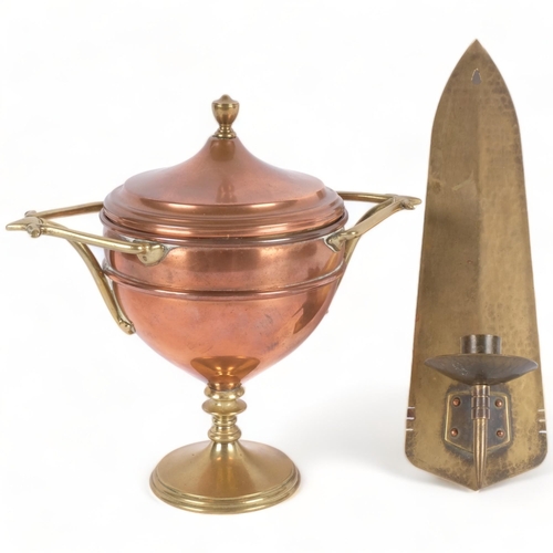 597 - An Arts and Crafts style brass wall candle holder, L26cm, unmarked, and a brass copper tea urn, H22c... 