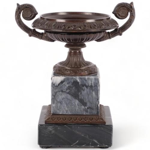 599 - A modern reproduction Eichholtz tazza bronze urn on stepped marble base, with decorative leaf collar... 