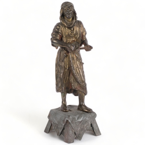 609 - A spelter figure on stand of an Arab musician, unmarked, H46cm