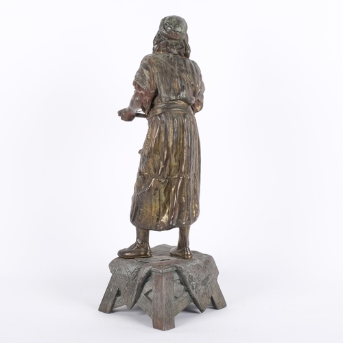 609 - A spelter figure on stand of an Arab musician, unmarked, H46cm