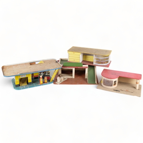 621 - A group of 6 tinplate and wooden toy garages, largest L48cm, H20cm, D30cm (6)