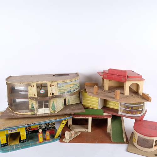 621 - A group of 6 tinplate and wooden toy garages, largest L48cm, H20cm, D30cm (6)