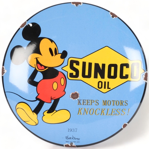 630 - A reproduction circular enamel sign, Sunoco Motor Oil, with Mickey Mouse caricature, diameter 30cm