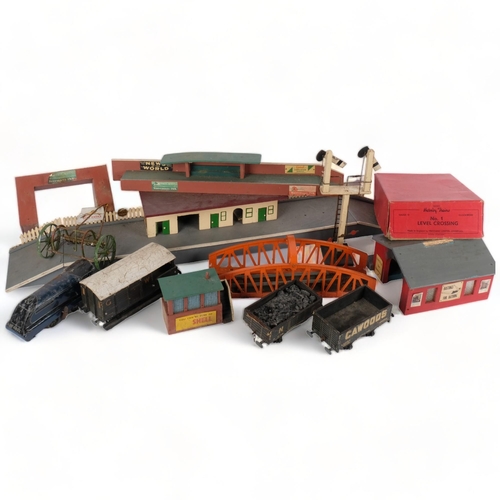 649 - A large quantity of Vintage train stations, O and OO gauge related in nature, including various sign... 