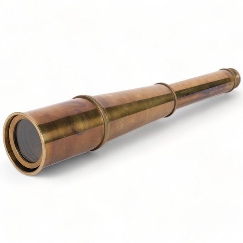 673 - A reproduction brass 4-draw telescope