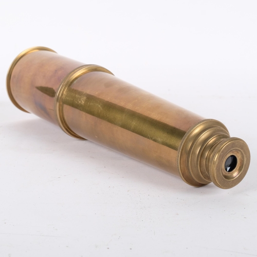 673 - A reproduction brass 4-draw telescope