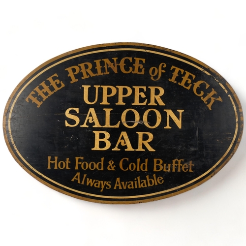 683 - A painted wood oval sign, advertising the Prince of Teck Saloon Bar, 81cm across