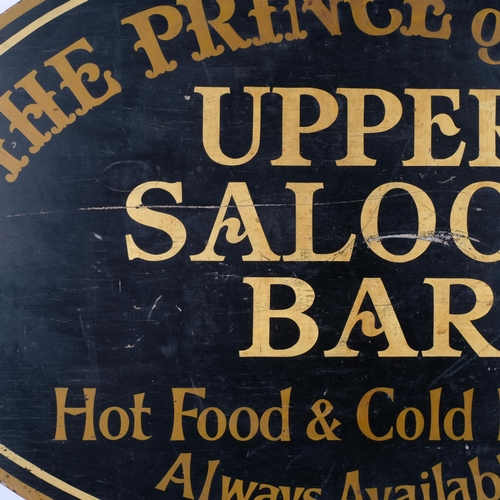 683 - A painted wood oval sign, advertising the Prince of Teck Saloon Bar, 81cm across