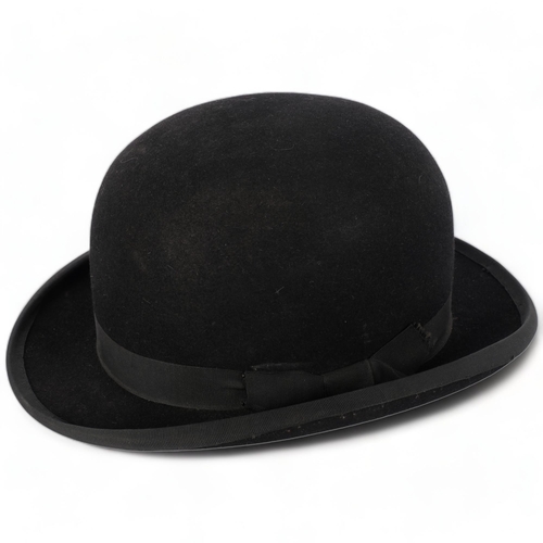 693 - A black bowler hat by Lock & Co, London