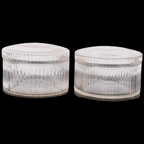 700 - A pair of cut-glass circular storage boxes, with lids, diameter 20cm (2)