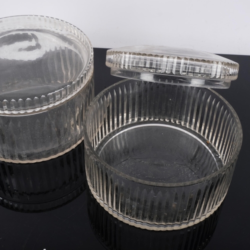 700 - A pair of cut-glass circular storage boxes, with lids, diameter 20cm (2)