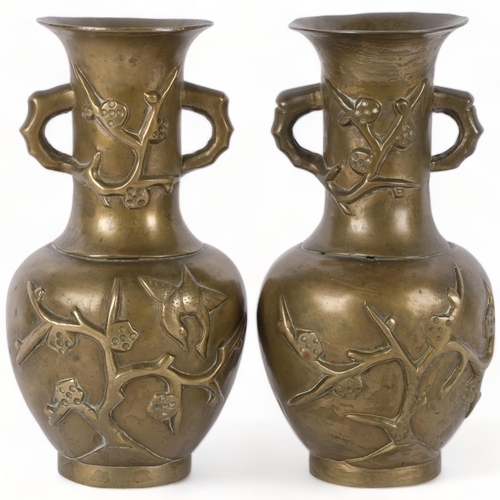 719 - A pair of heavy Chinese brass engraved vases, entwined with bonsai tree and bird decoration, marked ... 