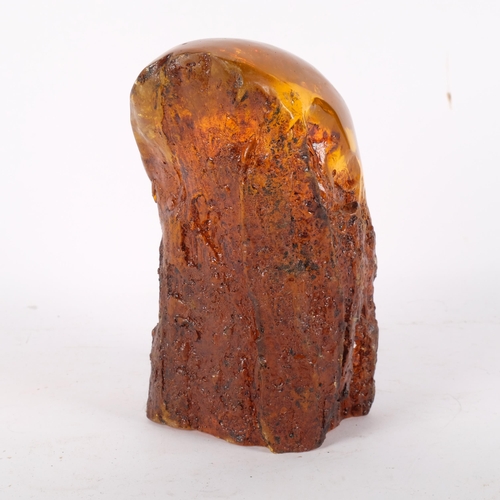 720 - A large faux amber block, with an insect trapped inside, H21cm