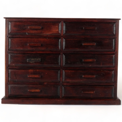 730 - A large modern stained wood table-top chest of 10 short drawers, each drawer split into compartments... 