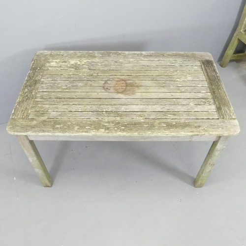 2659 - LISTER - A weathered teak slatted garden table. 120x68x71cm. With maker's label.