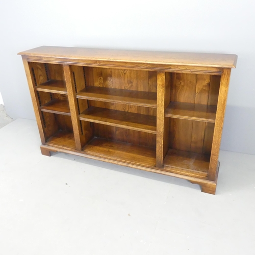 2667 - A modern oak open bookcase, with six adjustable shelves. 162x97x30cm.