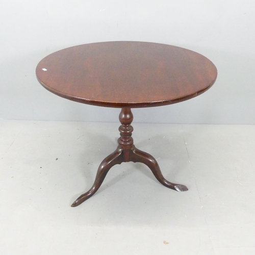 2676 - An antique mahogany circular tilt-top occasional table, with birdcage movement, central column and t... 