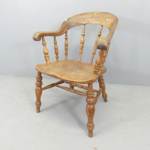 2677 - An antique elm-seated smoker's bow-arm desk chair.