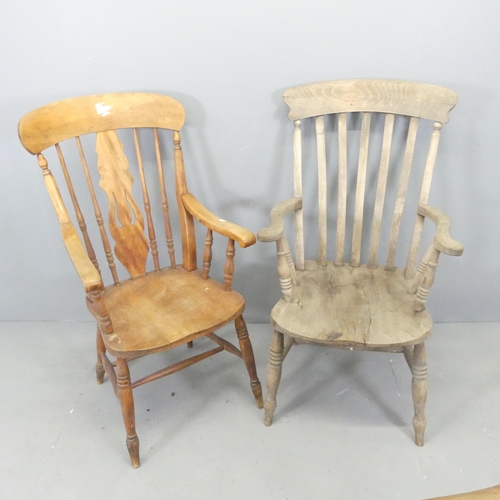 2678 - Two similar pine kitchen open arm chairs.