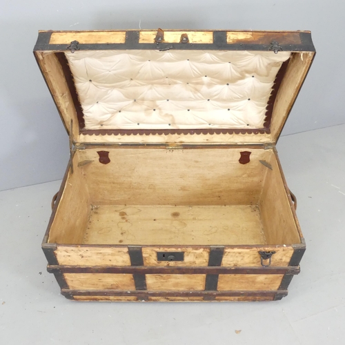 2681 - A 19th century pine dome top trunk, with metal and oak binding. 88x60x51cm.