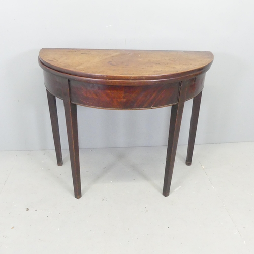 2687 - An antique mahogany demi-lune fold-over breakfast table. 92x72x46cm.