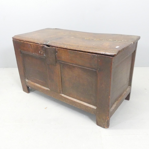 2697 - An 18th century panelled oak coffer. 87x50x42cm