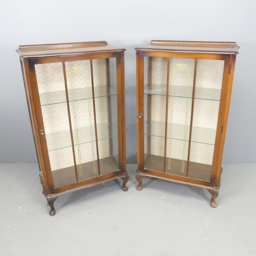 2700 - A pair of 1930s mahogany display cabinets, with glazed doors and two fixed shelves. 60x117x30cm.