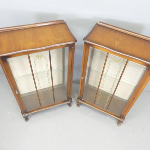 2700 - A pair of 1930s mahogany display cabinets, with glazed doors and two fixed shelves. 60x117x30cm.