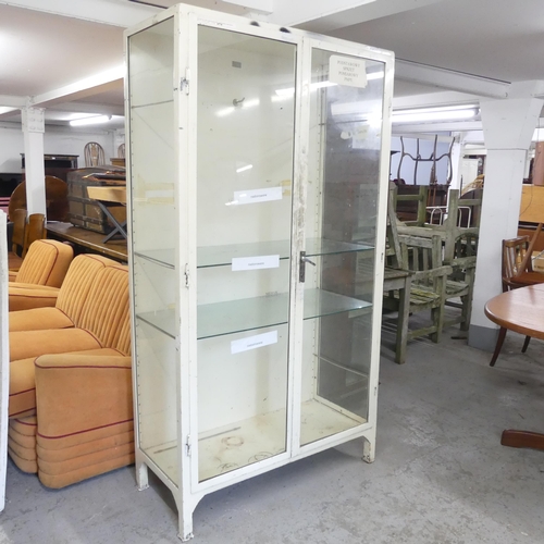 2717 - A vintage metal framed medicine cabinet, with two glazed doors and two adjustable shelves. 101x185x4... 