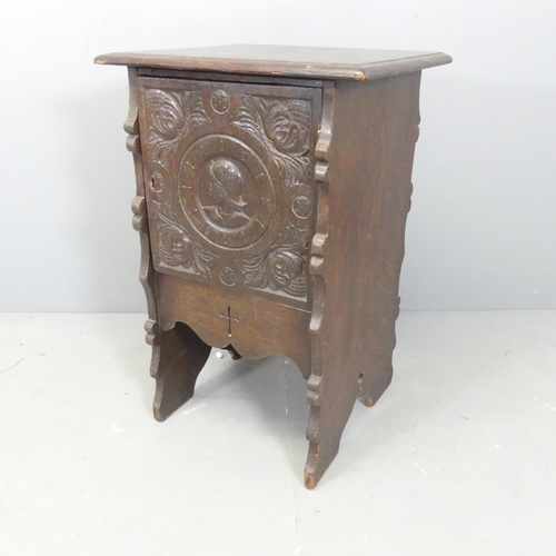 2718 - A French oak bedside cabinet, with chip-carved panelled door. 52x76x41cm.