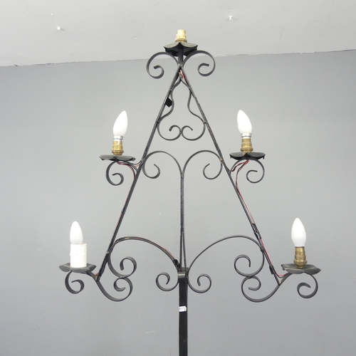 2720 - A painted wrought metal gothic candelabra converted to electric. Height 184cm.