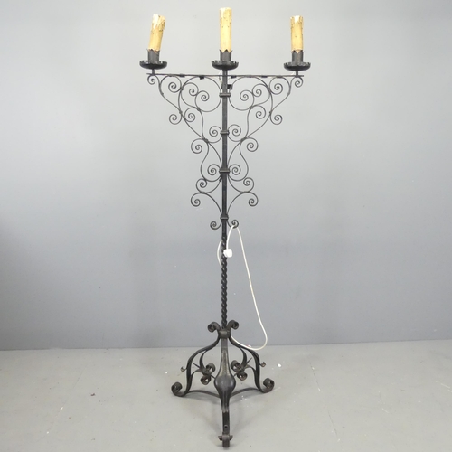 2721 - A painted wrought iron gothic candelabra converted to electric. Height 164cm.