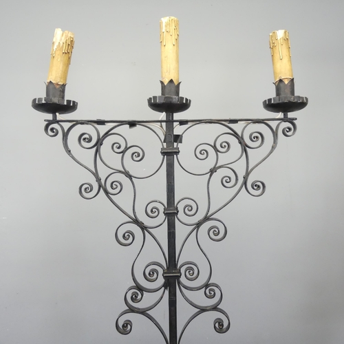 2721 - A painted wrought iron gothic candelabra converted to electric. Height 164cm.