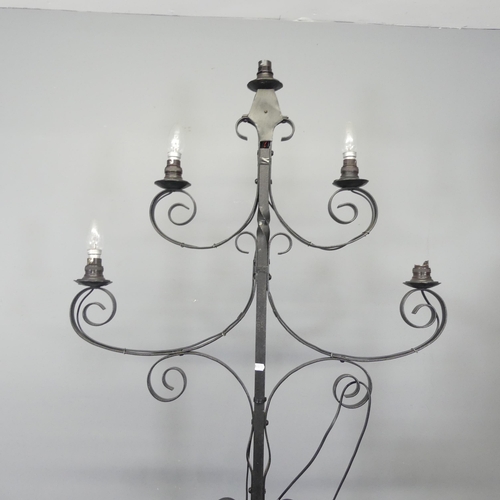 2722 - A painted wrought metal gothic candelabra converted to electric. Height 185cm.