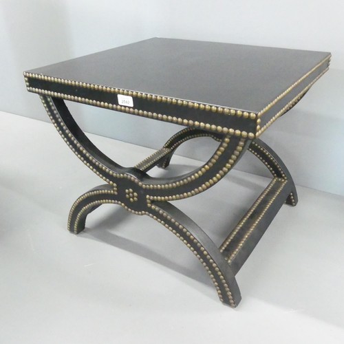 2042 - BAKER, USA - A studded black leather upholstered Alexandre x-framed stool. 61x51x56cm.