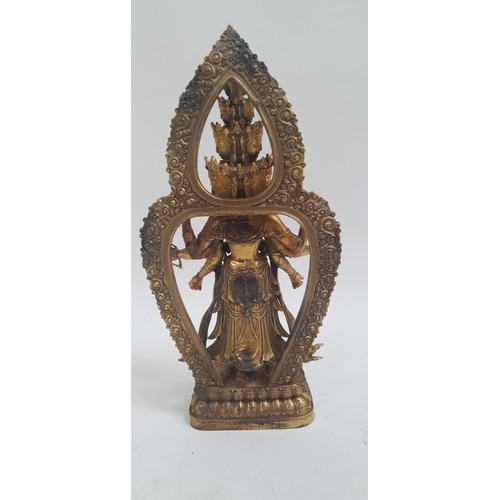 400 - A gilt-bronze multi-faced Buddha figure, inset with jewels, on lotus base, H27cm