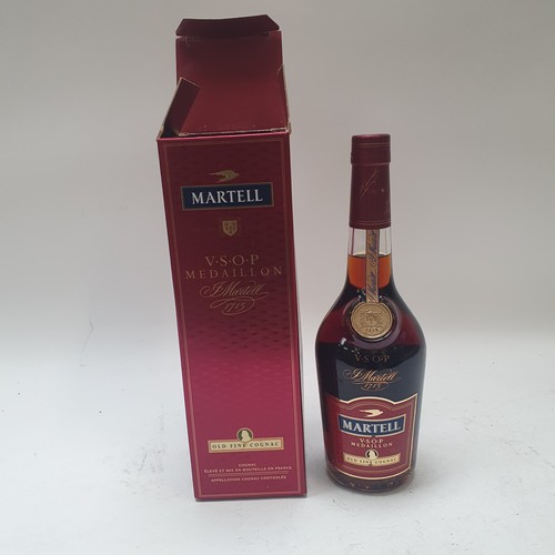 675 - Various bottles of spirits, including Remy Martin, and Martell Cognac