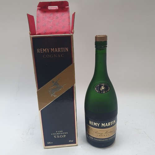 675 - Various bottles of spirits, including Remy Martin, and Martell Cognac