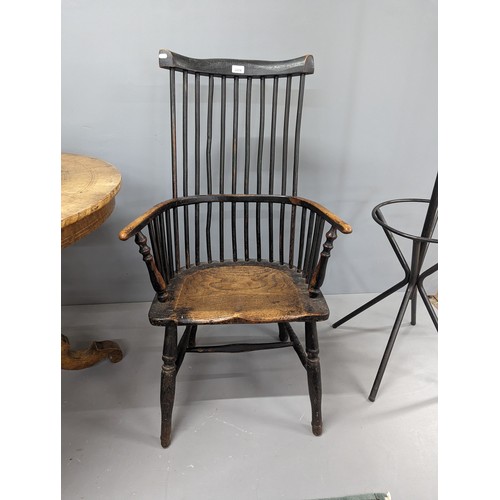 2204 - Two similar ash and elm-seated Welsh comb-back arm chairs.