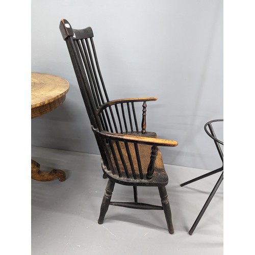 2204 - Two similar ash and elm-seated Welsh comb-back arm chairs.