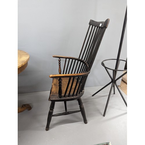 2204 - Two similar ash and elm-seated Welsh comb-back arm chairs.