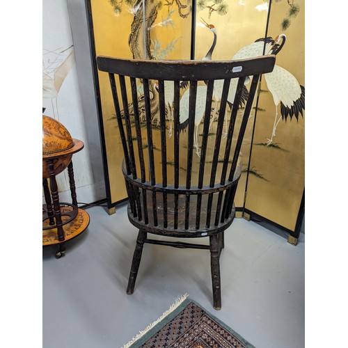 2204 - Two similar ash and elm-seated Welsh comb-back arm chairs.