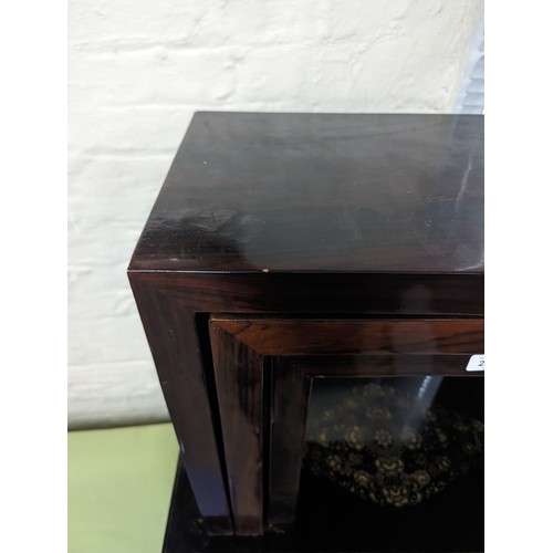 2256 - A modern rosewood veneered nest of three rectangular occasional tables. Largest 60x49x30cm.