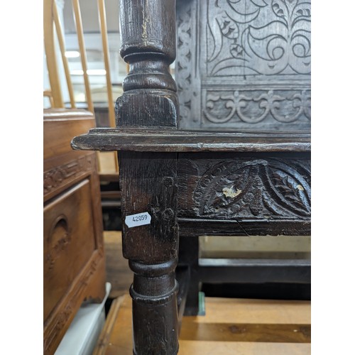 2188 - A late 18th / early 19th century joined oak Wainscot chair. Overall 66x112x53cm, seat 48x48x36cm.