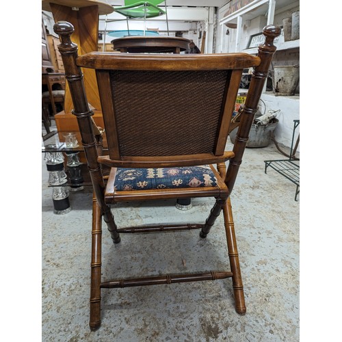 2729 - A pair of mahogany faux bamboo campaign style folding chairs with upholstered drop-in seats.