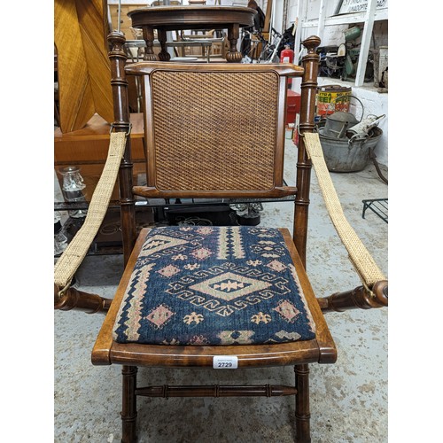 2729 - A pair of mahogany faux bamboo campaign style folding chairs with upholstered drop-in seats.