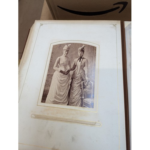 88 - A Victorian velvet covered photograph album, containing a collection of carte de visite and cabinet ... 