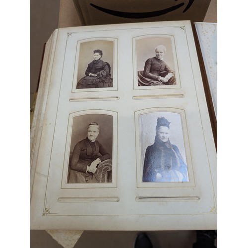 88 - A Victorian velvet covered photograph album, containing a collection of carte de visite and cabinet ... 