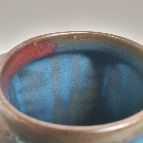 395 - A square Oriental stoneware vase, with blue and red glaze, 23cm