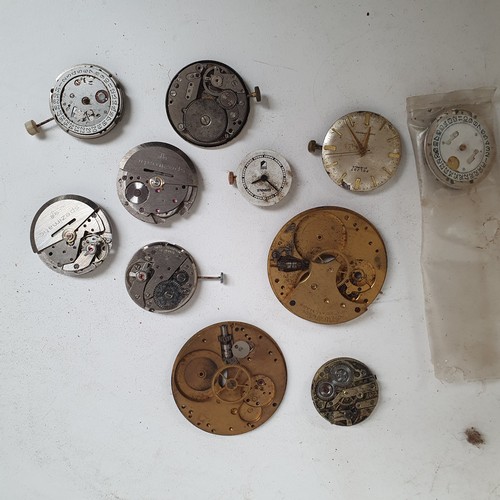 359 - A collection of watch faces and parts, clock movements etc